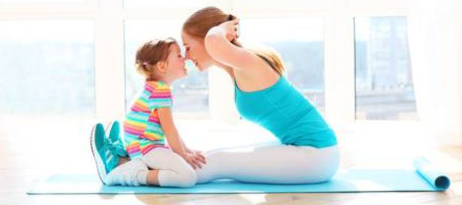 picture of the a women and her kid doing exercise together