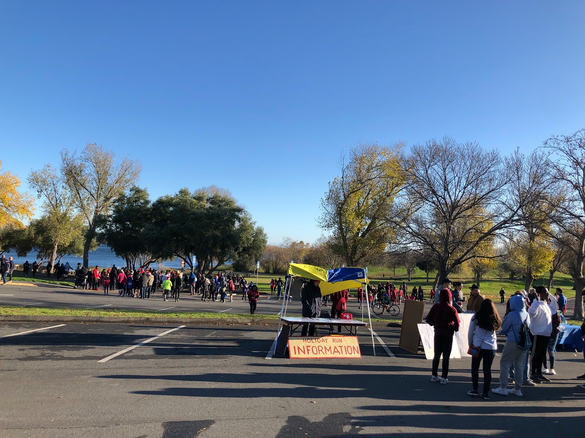 picture of people in the background and a booth at the holiday run