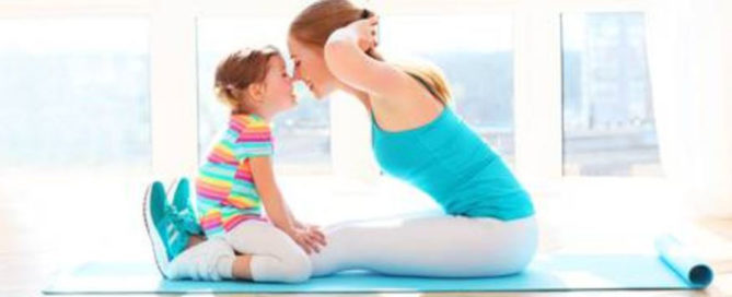 picture of the a women and her kid doing exercise together
