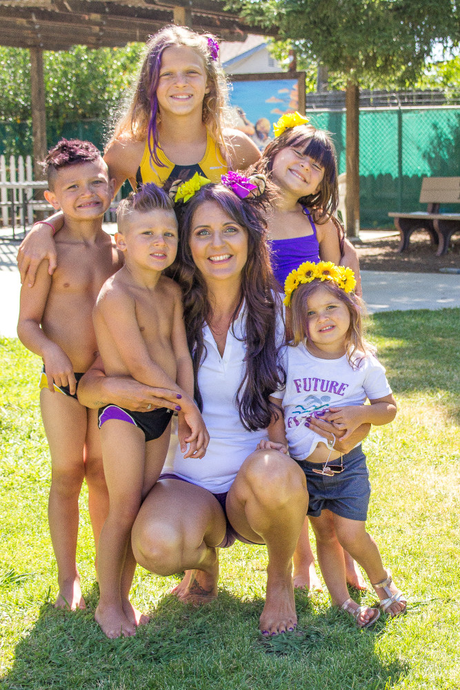 Swim instructor Nicole posing with her children